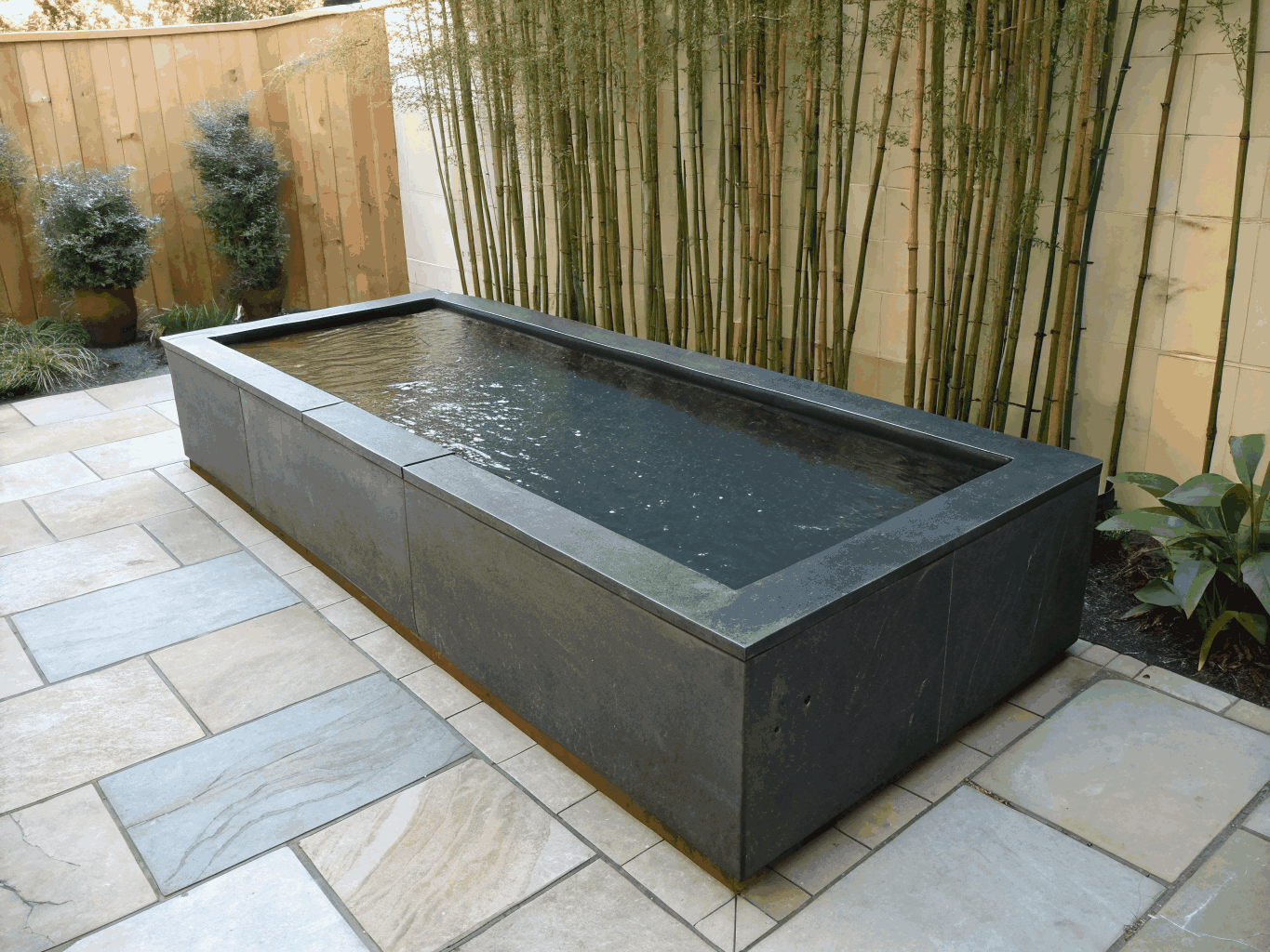Custom Water Feature with Rich Teal Illumination